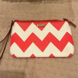 Kate spade orange and white wristlet